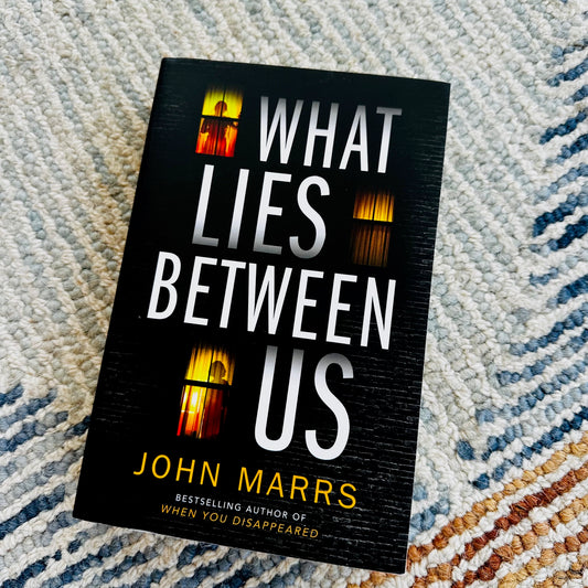 What Lies Between Us by John Marrs Used Book